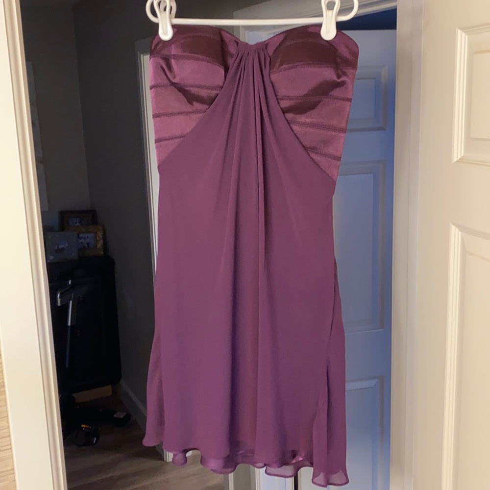 La Femme strapless eggplant mini dress with crossed detailing in the back